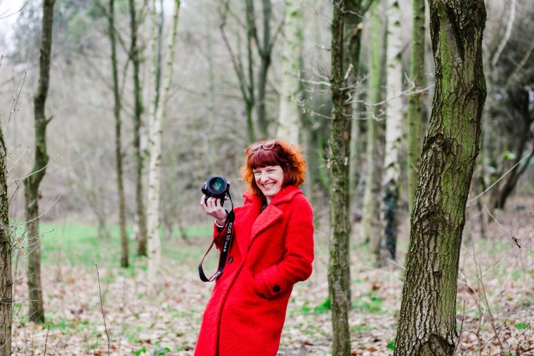 woman with camera and red hair - photogrpaher